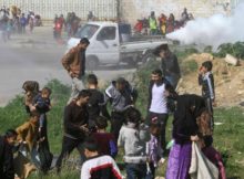 Image of Syrian refugees during fumigation