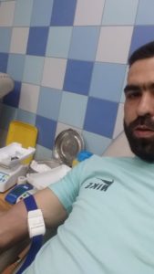 Mohamed donating blood